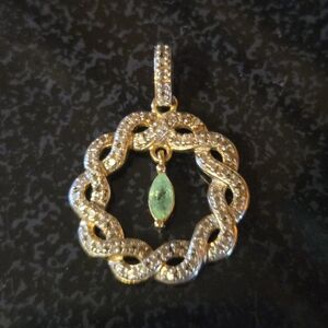 Elegant Gold and Silver Pendant with Green Gemstone